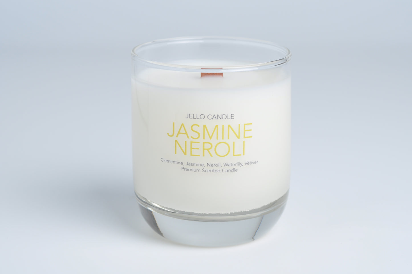Aroma Container Candle in Jasmine Neroli scent, highlighting the soothing fragrance and natural wooden wick.