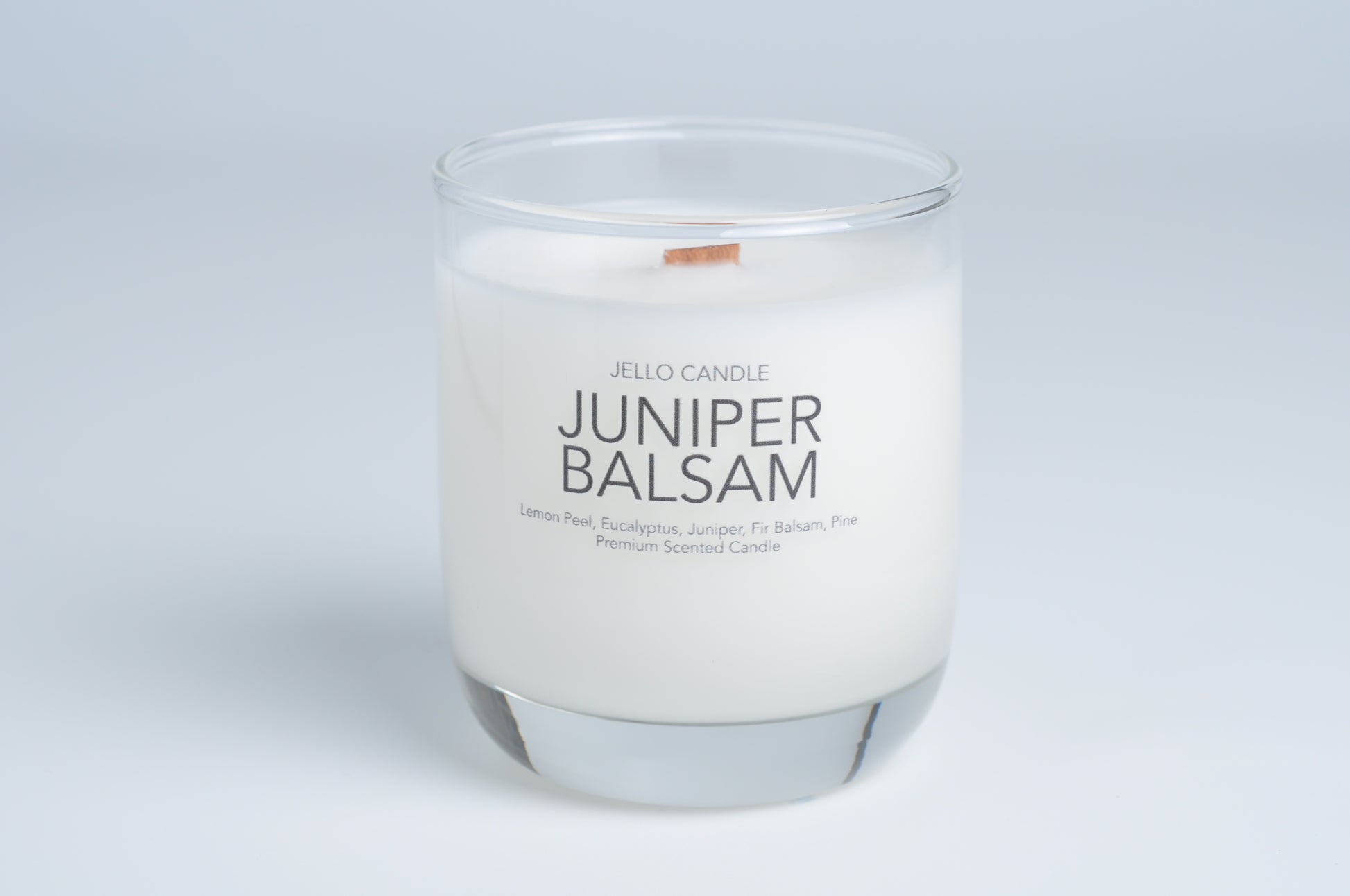 Aroma Container Candle in Juniper Balsam scent, crafted with premium coconut-soy wax and featuring a sustainable wooden wick.