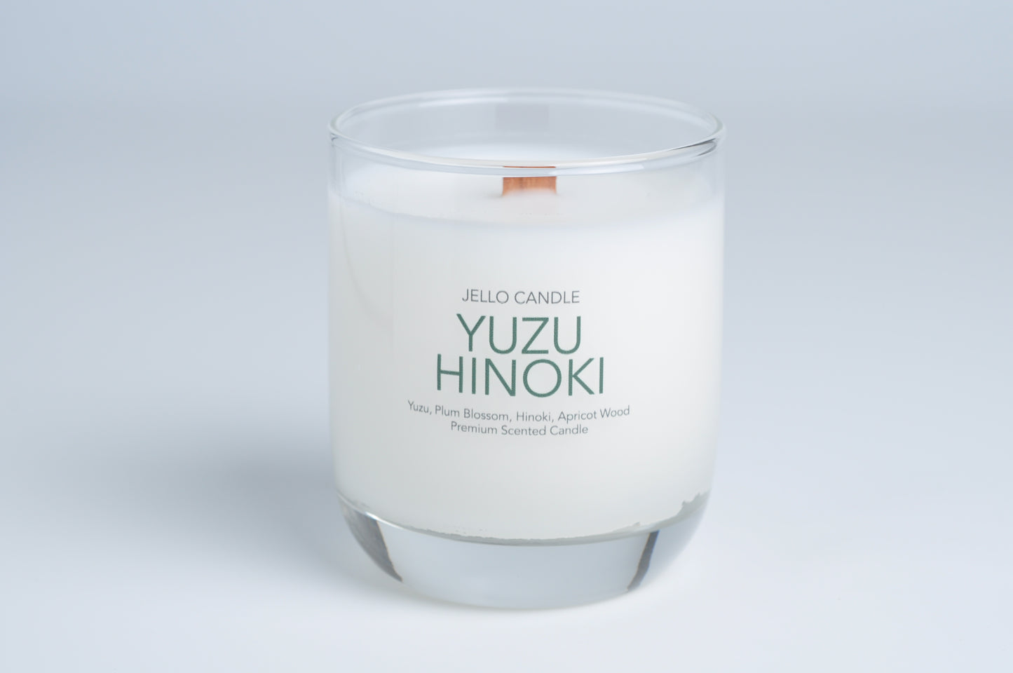Aroma Container Candle in Yuzu Hinoki scent, featuring a premium coconut-soy wax blend and FSC-certified wooden wick.