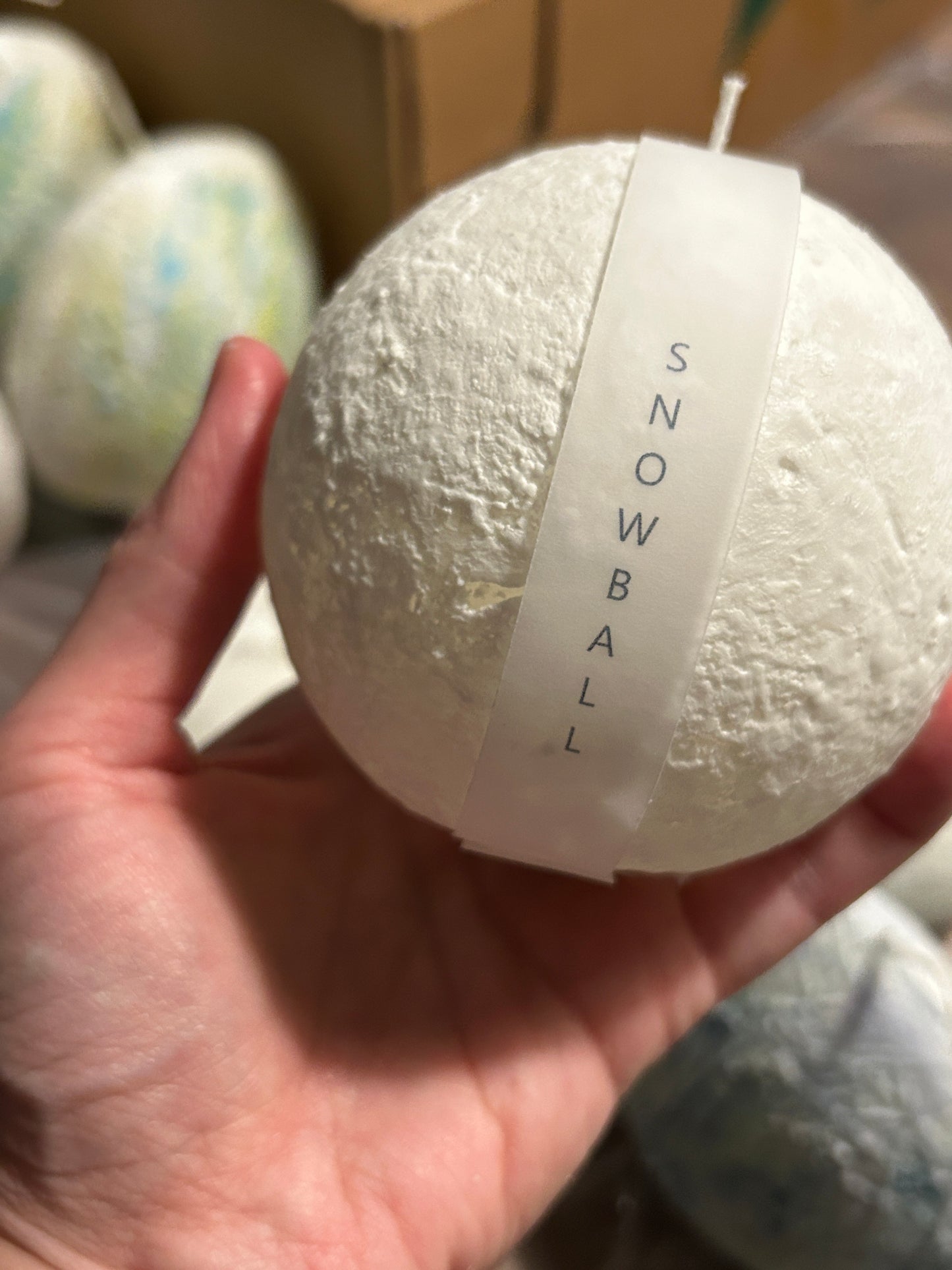 Close-up of the Snowball Candle's textured surface, showcasing its handcrafted appeal.