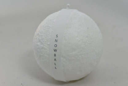 Unlit Snowball Candle displayed elegantly, highlighting its unique snowball shape.